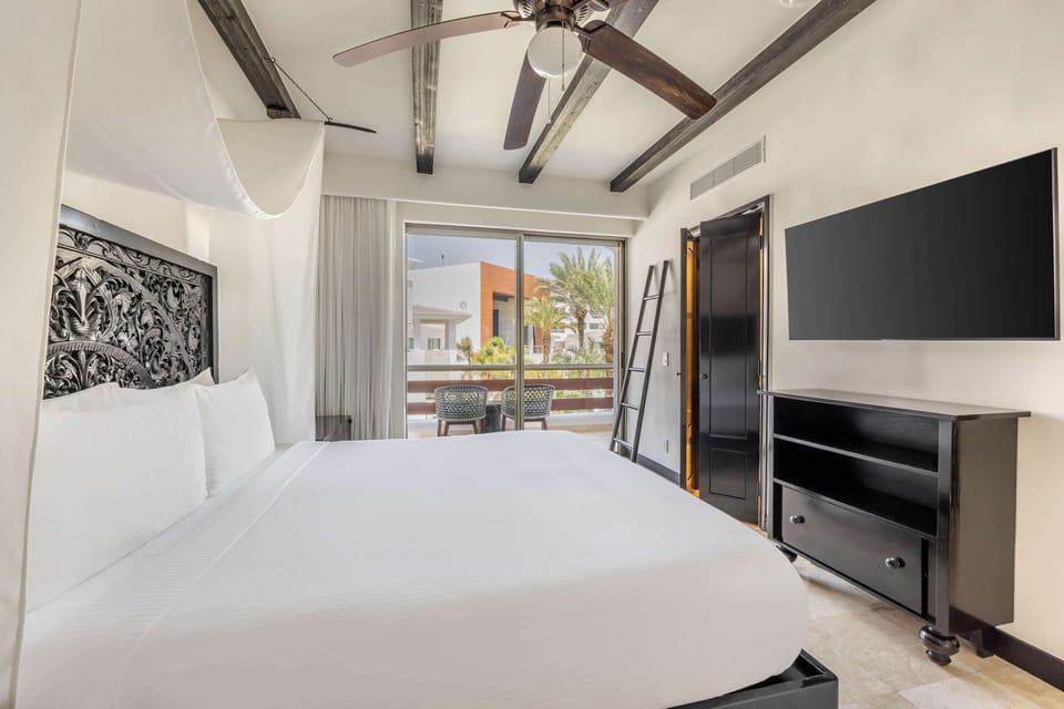 Wake up to balcony light and serene resort surroundings.