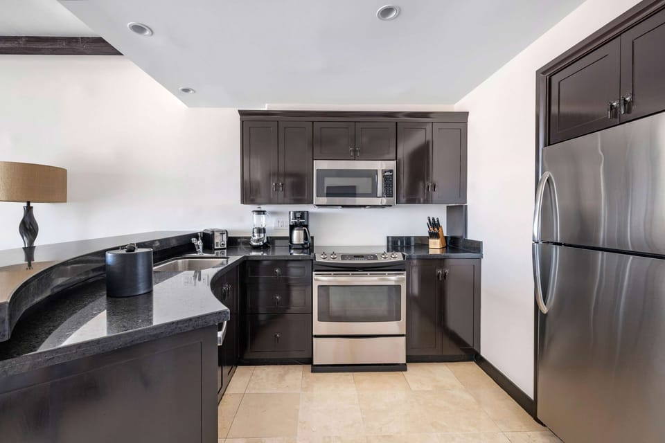 Cook with ease in a sleek kitchen with modern appliances.
