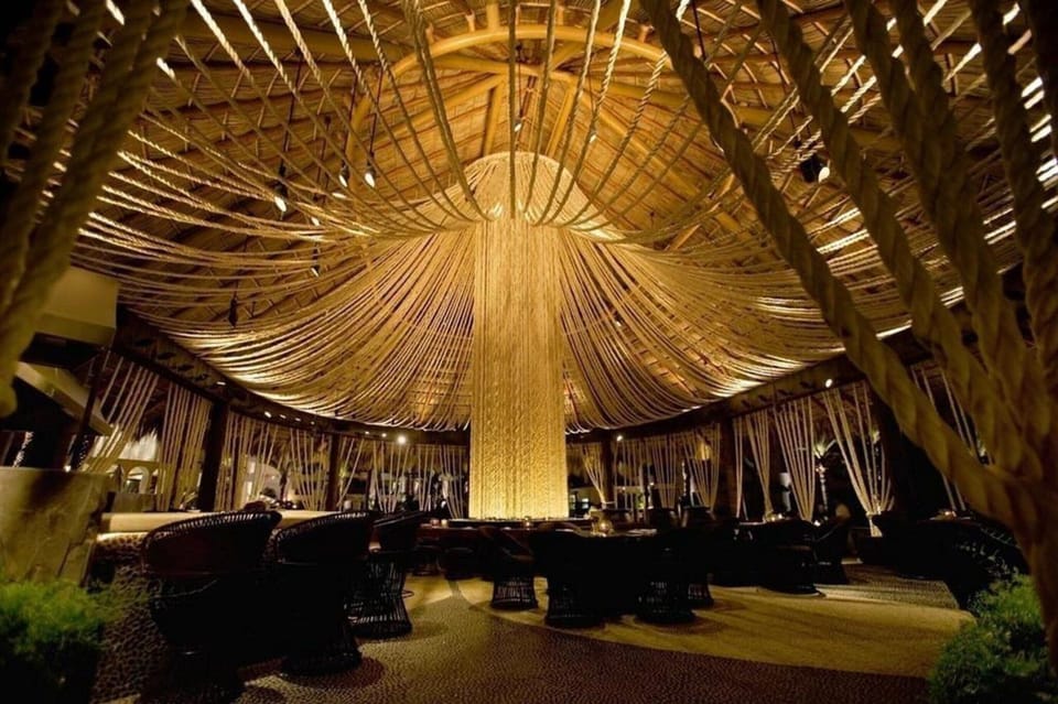 Soak in golden evening glow beneath dramatic chandelier lighting.