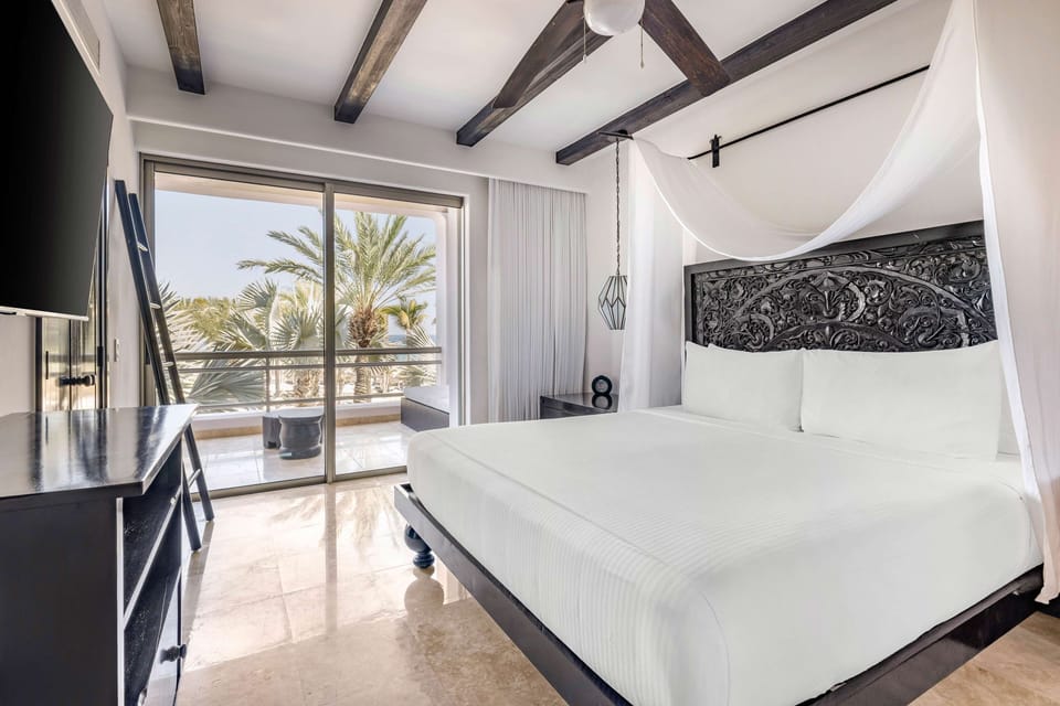 Wake up refreshed in a serene canopy bed retreat.