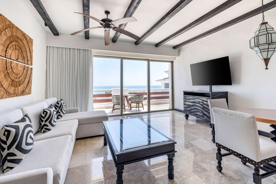 Sip morning coffee while the sea breeze fills the room.