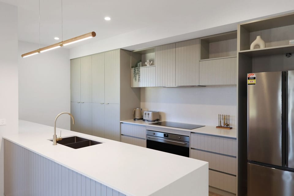 Well-appointed kitchen with spacious island and modern appliances