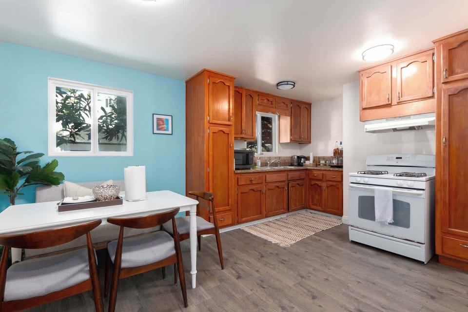 Open kitchen and dining area for shared meals.