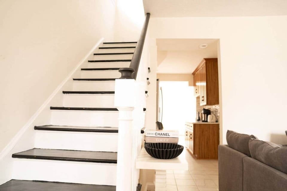 Stylish staircase connecting the main living areas and the bedroom