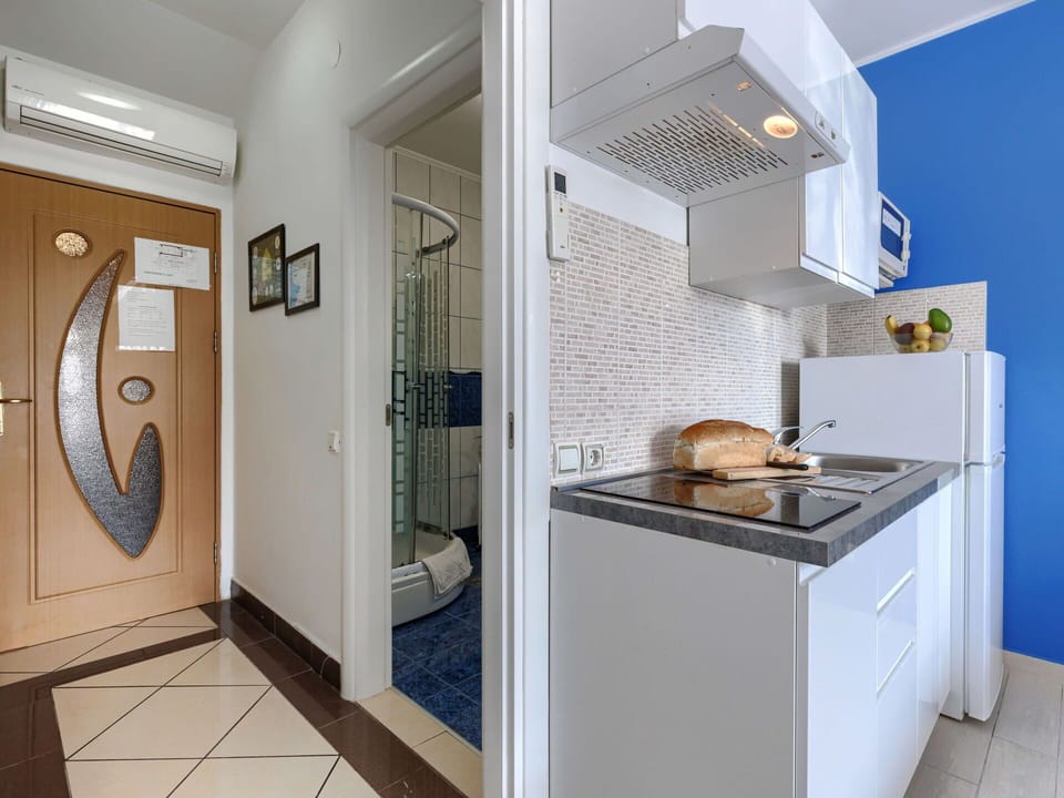 Flooring, Interior Design, Floor, Home, Room, Plumbing Fixture, Major Appliance, Door, Countertop, Apartment