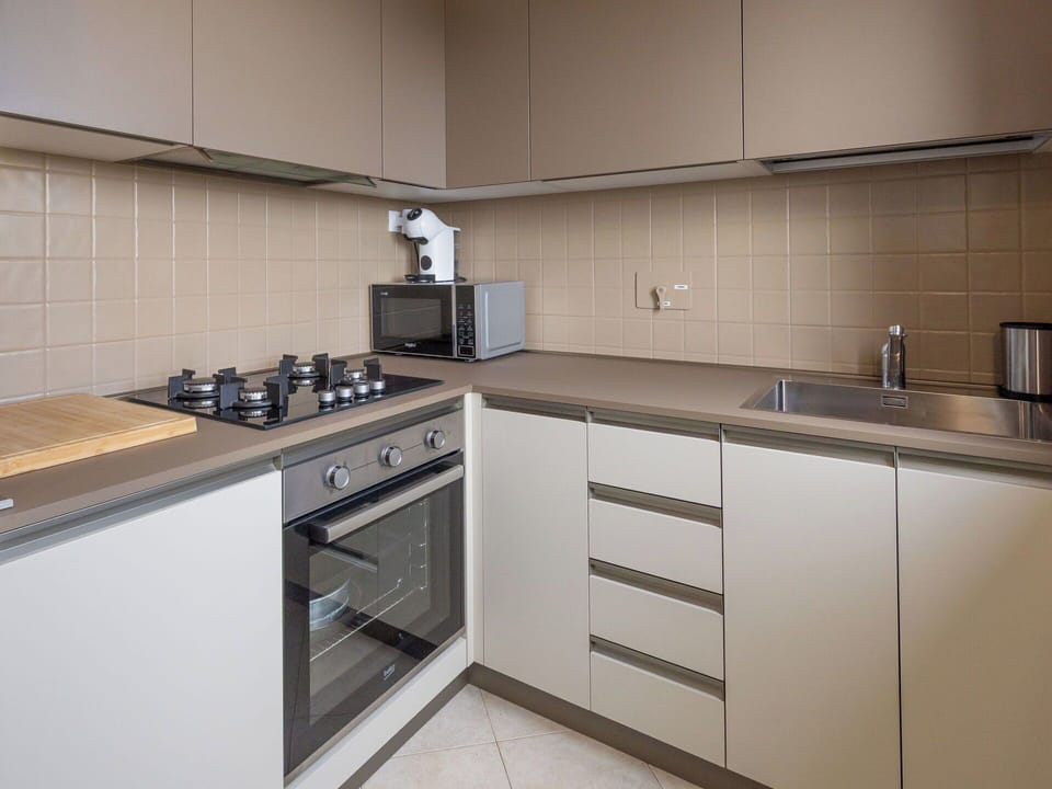 Kitchen, Kitchen Appliance, Countertop, Cabinetry, Major Appliance, Kitchen Stove, Interior Design, Wood, Home Appliance, Stove