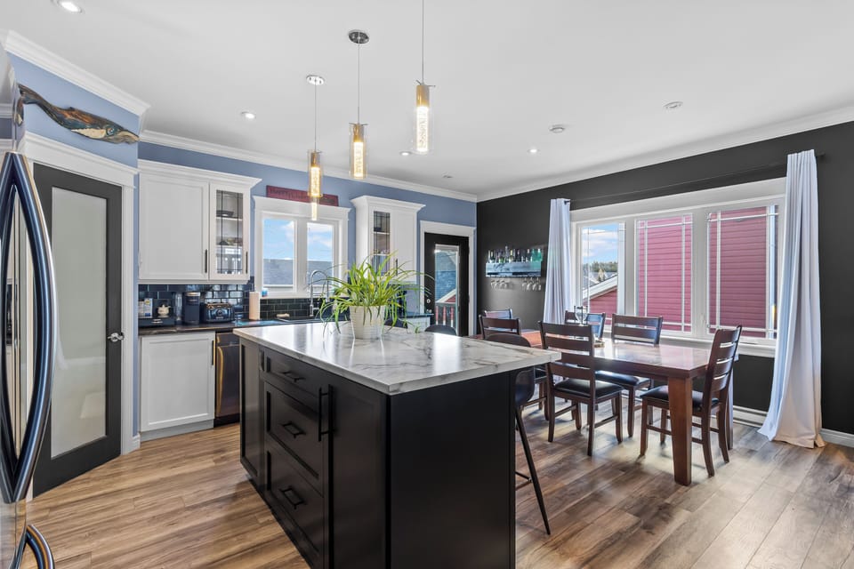 Large kitchen island with seating—ideal for meals and socializing.