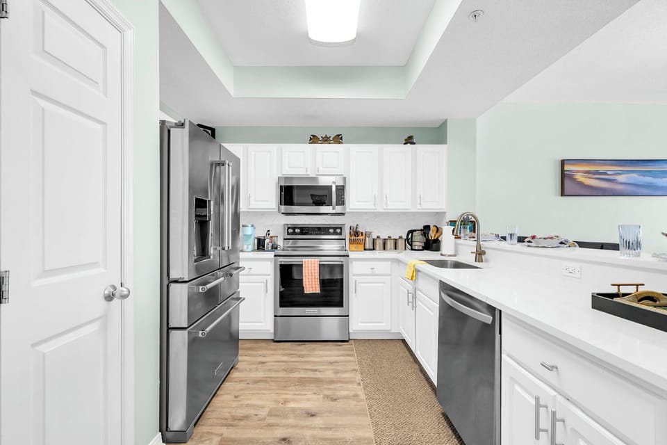 Your fully equipped kitchen features ample counterspace, perfect for preparing memorable meals for the family during your stay.