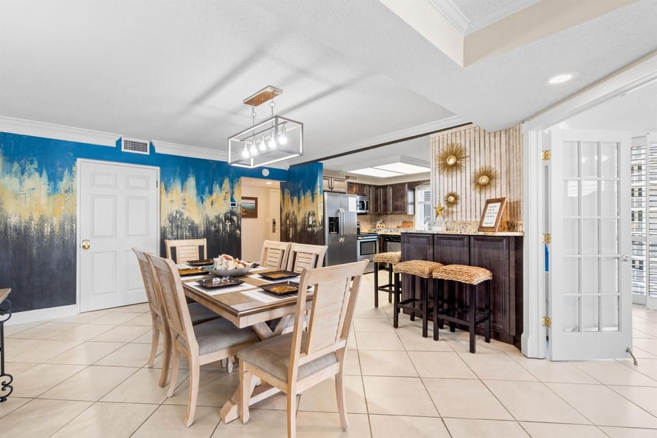 Your open dining area flows seamlessly into a fully equipped kitchen, perfect for memorable meals together.