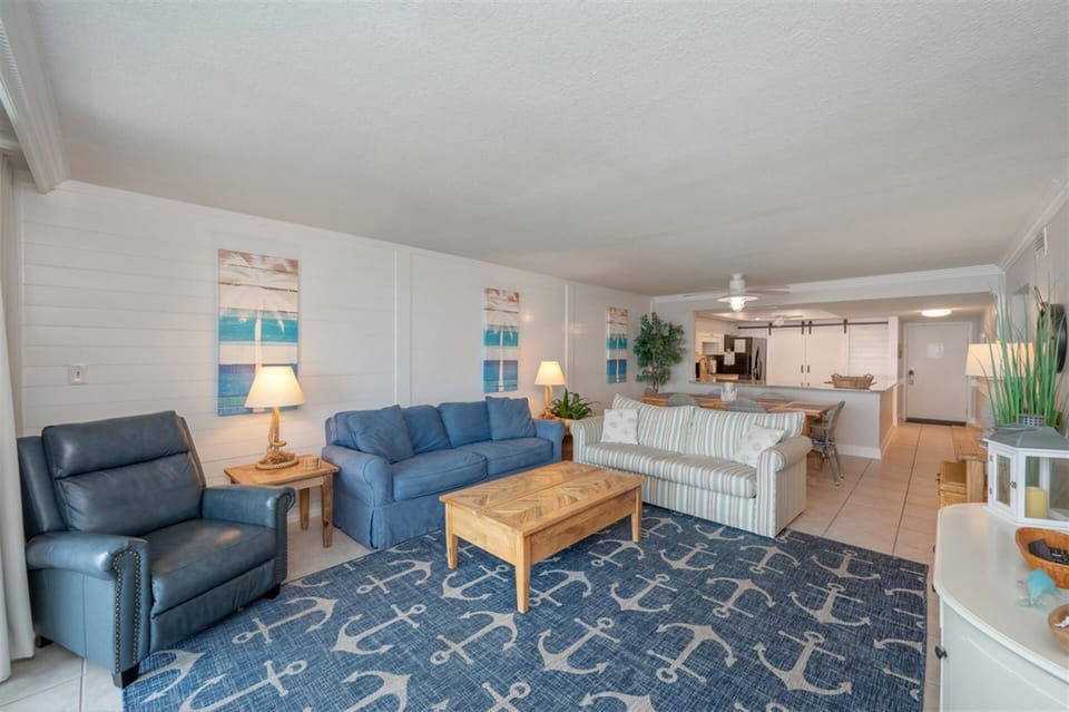 Relax in your coastal-themed living room with plush seating and nautical touches that perfectly capture beachside charm.