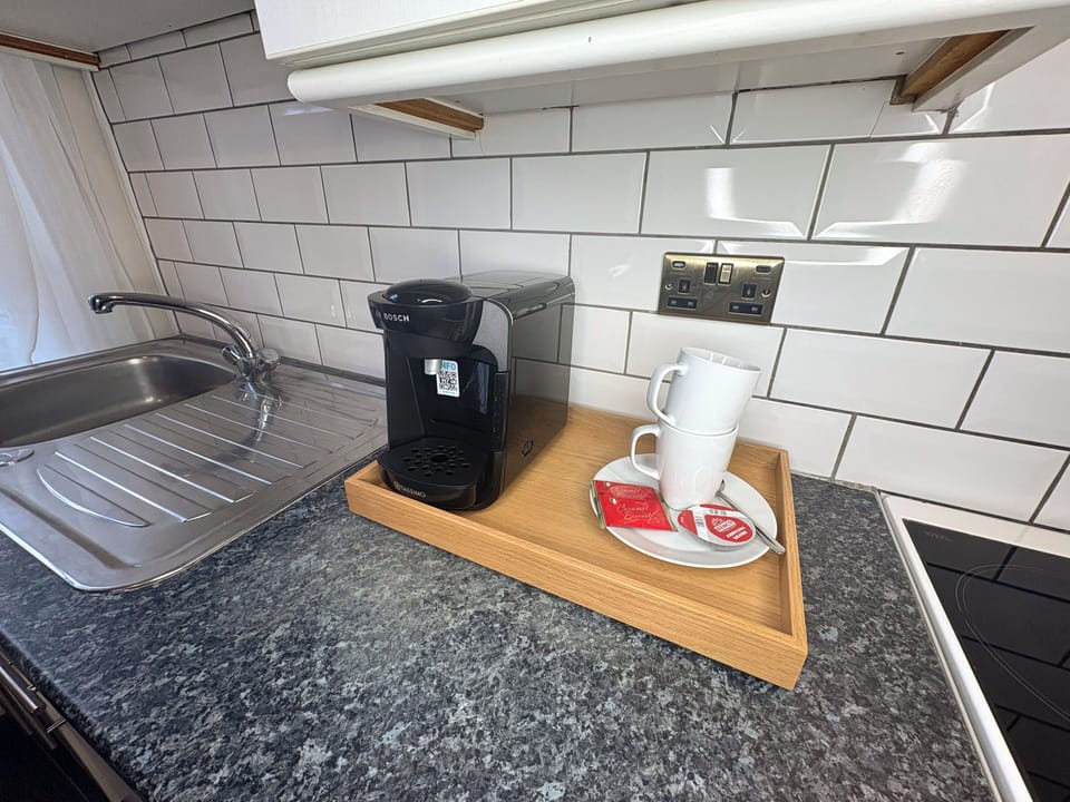 Fully equipped kitchen with coffe station and essentials provided.