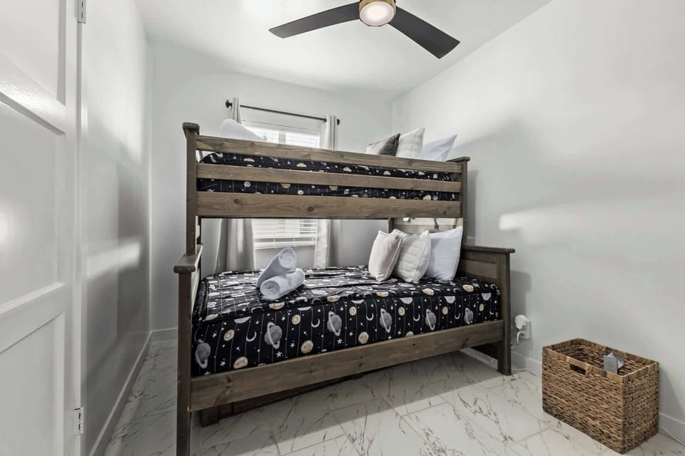 Comfortable bedrooms, each with its own TV, offering privacy and restful sleep for everyone.
