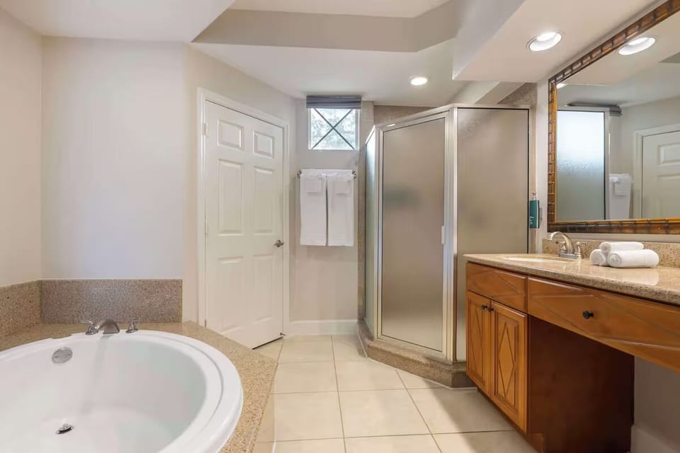 Rinse off comfortably in a clean, well-lit bathroom space.