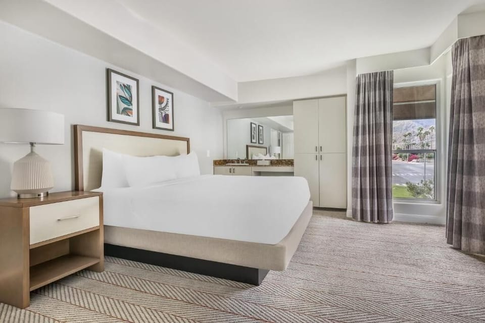 Sink into a plush king bed for deep, restful sleep.
