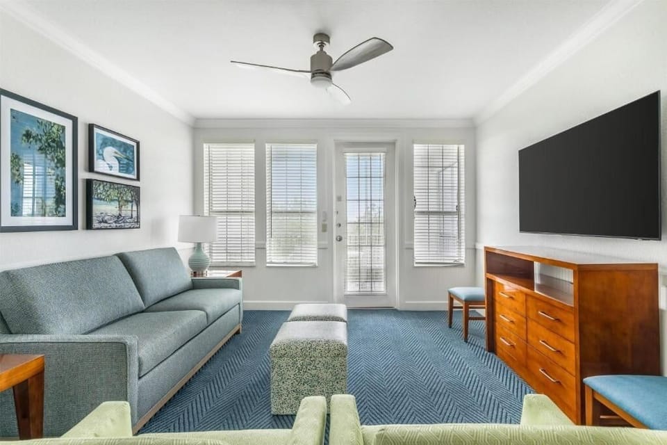 Relax on the plush sofa with breezy daylight pouring in.