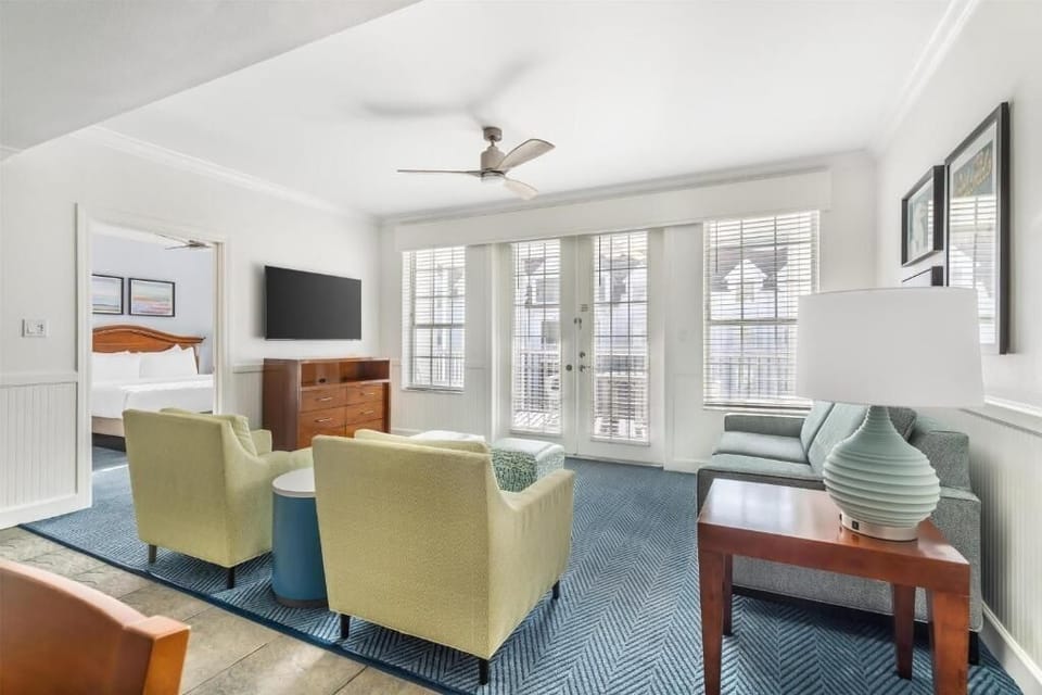 Gather in the sunlit lounge with roomy seating and TV.