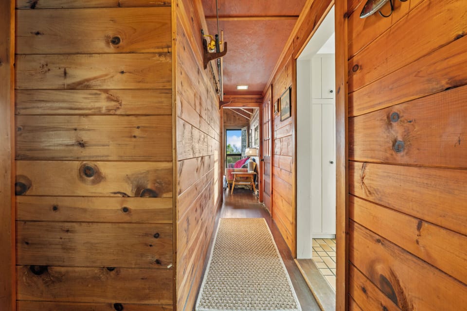 Hallway views of the shared dining/ living area.