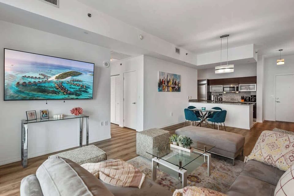 Living room with cozy seating and a smart TV perfect for relaxing or working remotely.