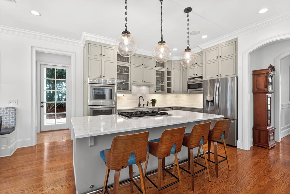 Chef's kitchen with eat-in bar and entertaining flow