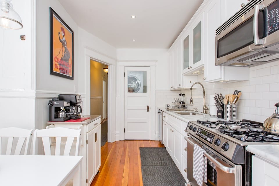 Kitchen with in-unit washer & dryer in the laundry closet 