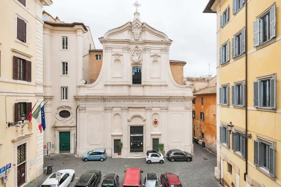 Romantic view of baroque church over a quiet cobblestone piazza