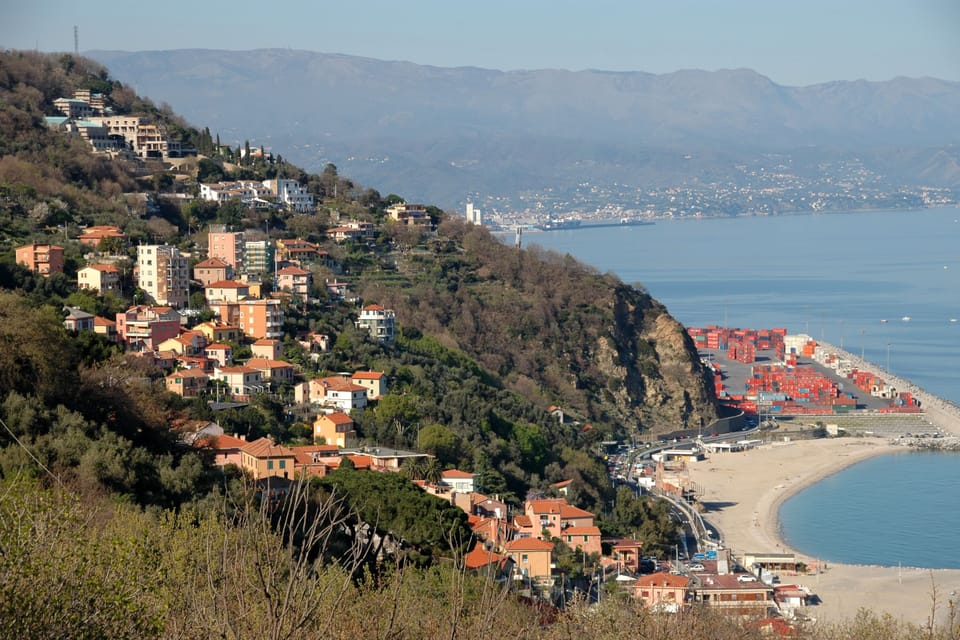 Aerial view of Bergeggi, the town of Savona in the background