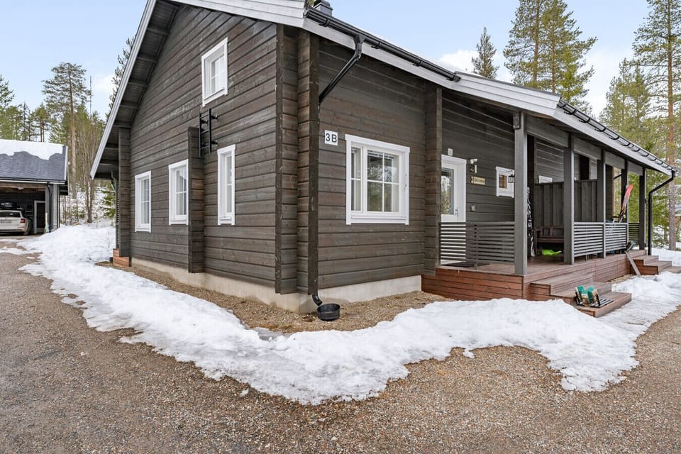 Traditional dark-log architecture with a modern, cozy feel.