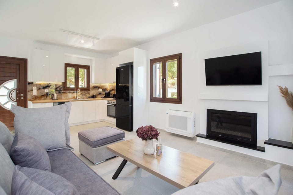 Stylish lounge area with fireplace and smart TV.