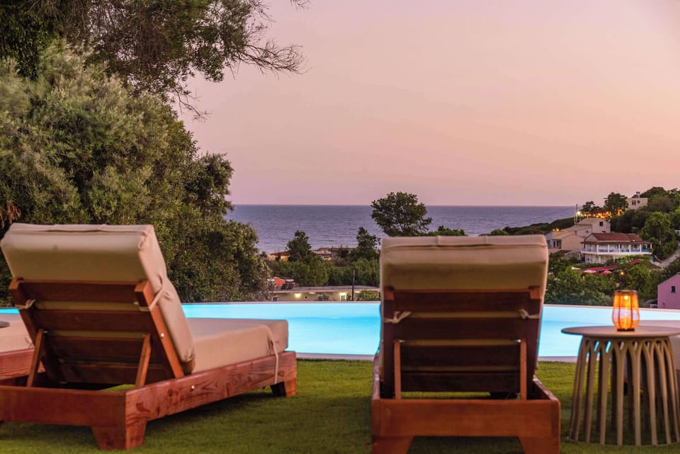 Unwind on the sun loungers while enjoying sea views and sunset colors.