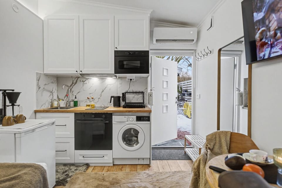 Kitchenette with oven, hob, microwave and washing machine