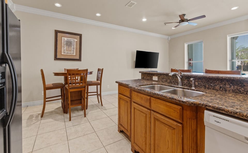 Open kitchen and dining area with an open view into the living space