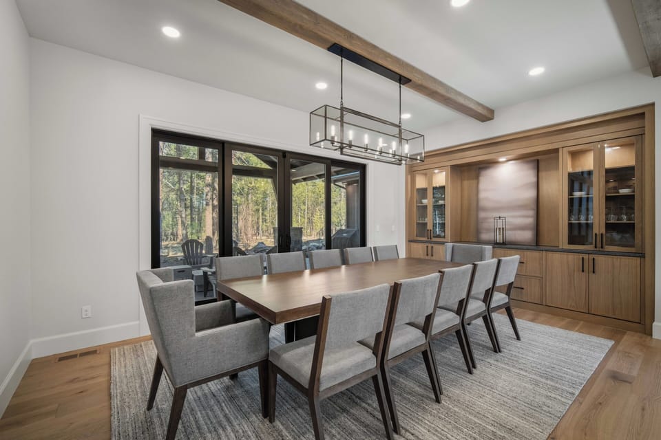 Gather your group around this elegant dining table with seating for twelve, perfect for memorable meals together in this sophisticated space.