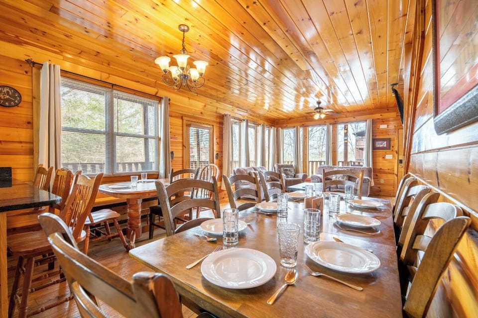 Gather around rustic wooden tables where warm cabin charm meets elegant dining—your perfect spot for memorable meals together.