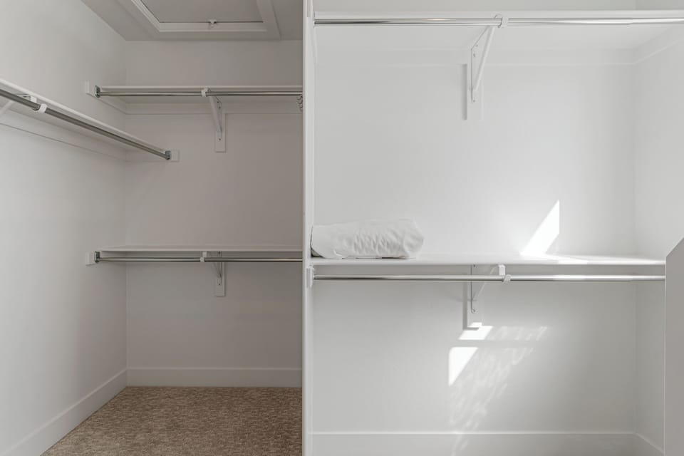 Your spacious walk-in closet offers plenty of room to organize and hang all your belongings during your stay.