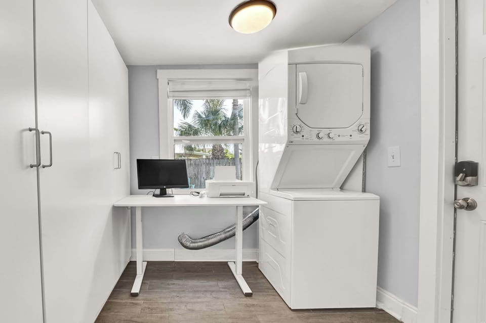 Private washer and dryer with dedicated workspace.