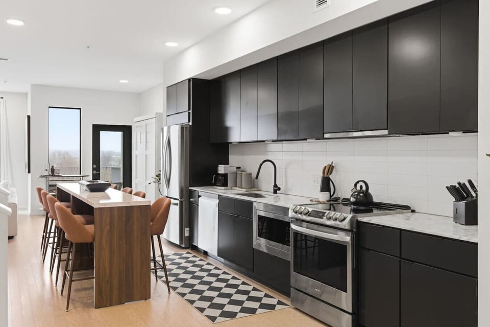 Fully equipped, modern kitchen for all of your cooking needs! Has a kitchen island with dining seating for 8.