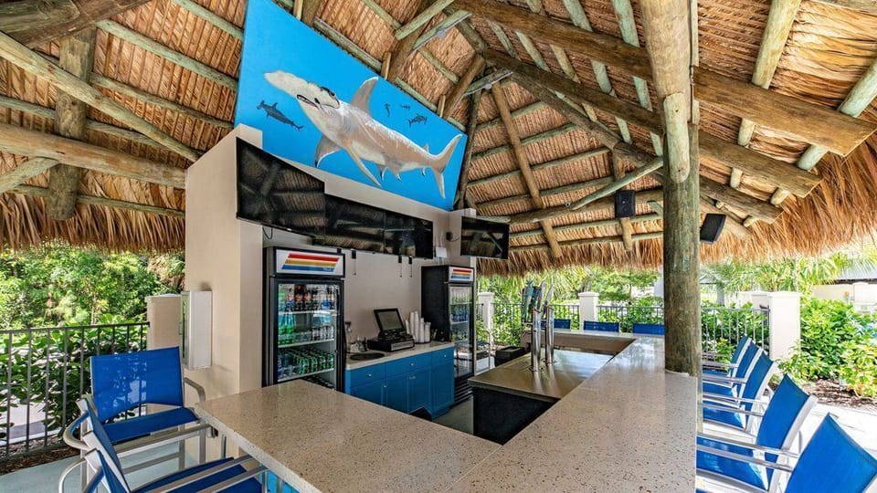 Sip your favorite drink at the tiki bar, where tropical vibes meet stylish design.