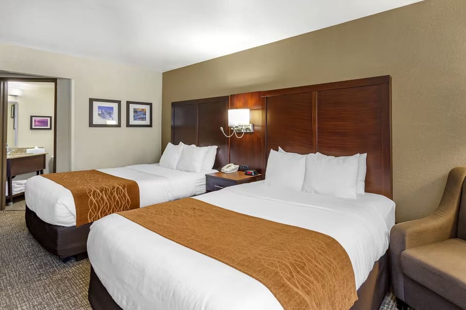 Drift off easily in a calm, roomy two-bed layout.