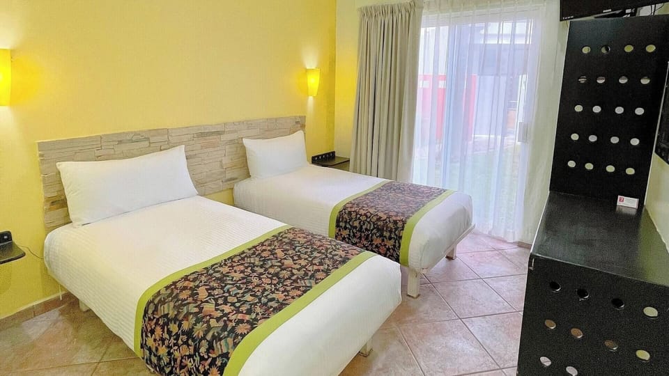 Stretch out on fresh linens in a warm, welcoming room.