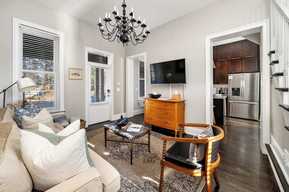 Cozy living room with smart TV and comfortable seating.