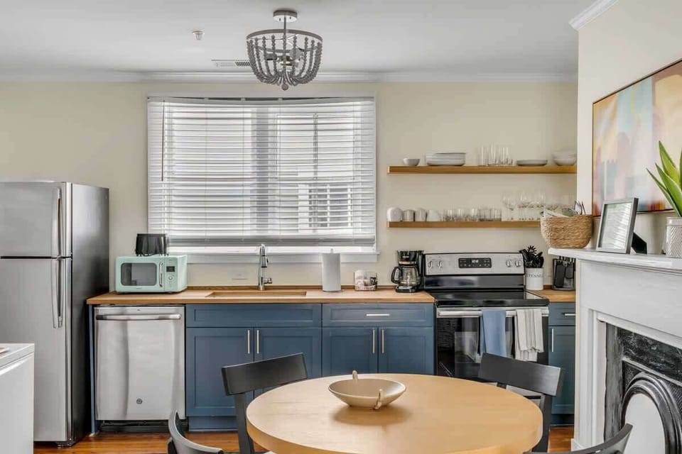 A well-appointed kitchen paired with a comfortable dining space for 4 guests.