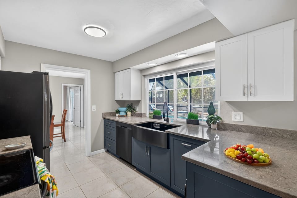 Beautiful kitchen with a farmhouse sink, generous counter space, and a warm, inviting feel that makes cooking and gathering effortless and enjoyable.