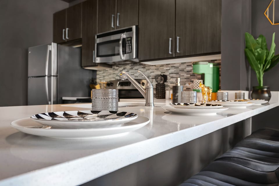 ✦ Kitchen ✦ Quartz counters, stylish settings + bar seating for four.