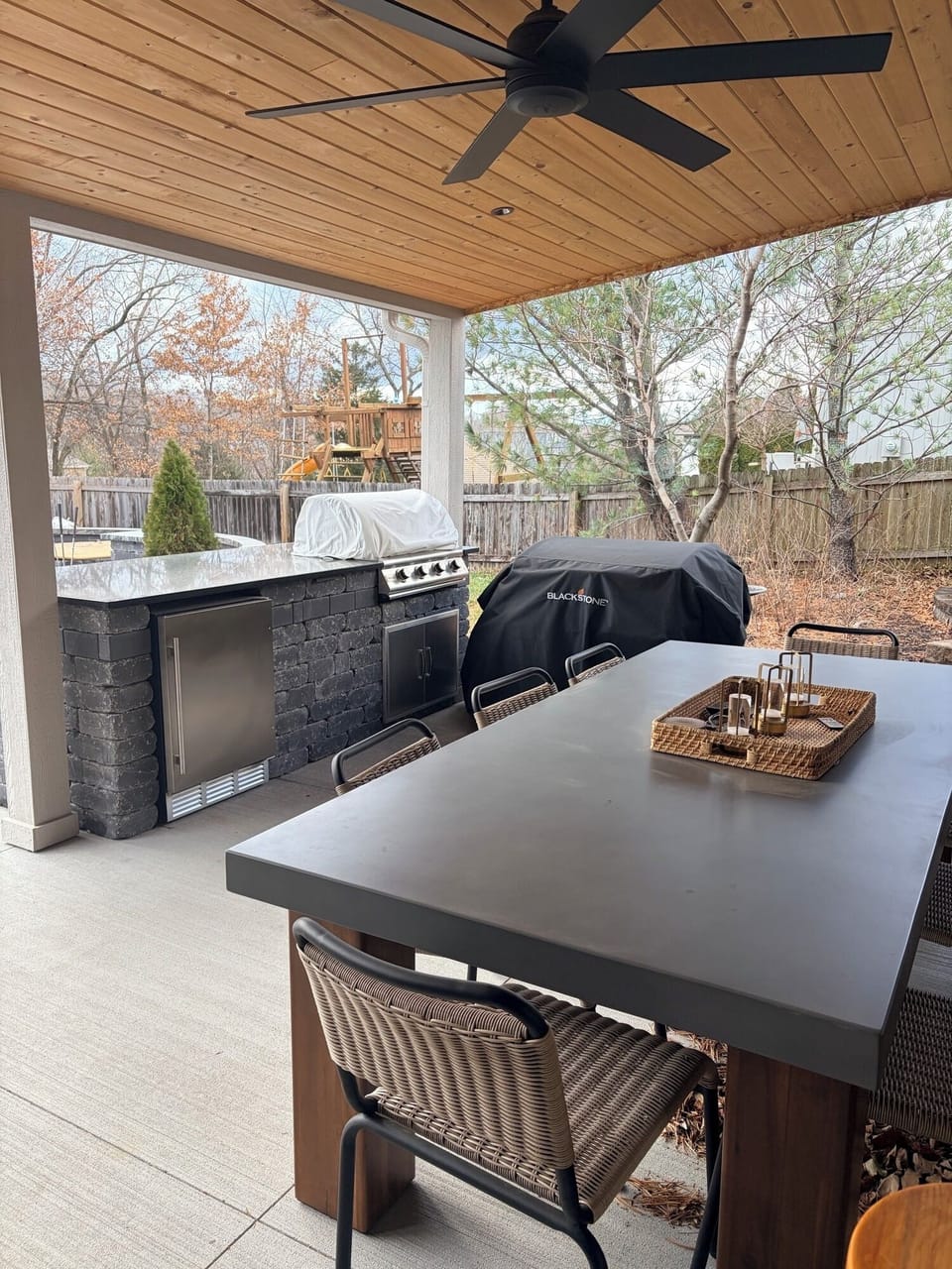 Outdoor covered kitchen and dining area.  Blackstone and Grill