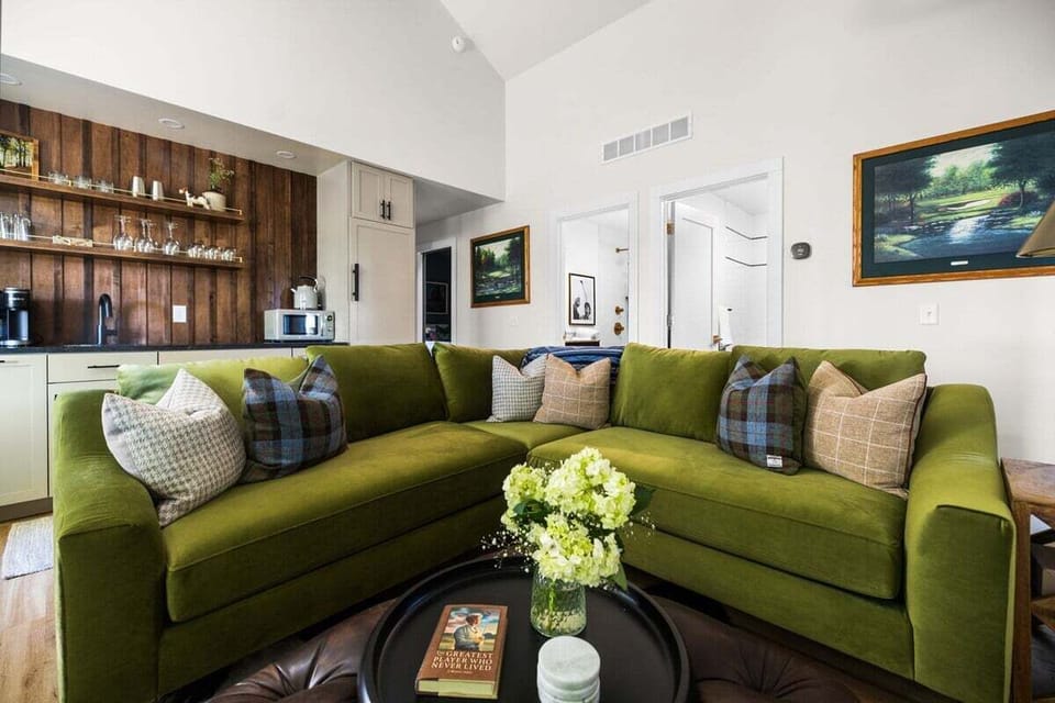 Gather, unwind, and settle in 🛋️🌿

This spacious sectional is perfect for movie nights, morning coffee, or cozy conversations after a day of exploring. With warm wood accents and an inviting layout, it's the heart of the home.