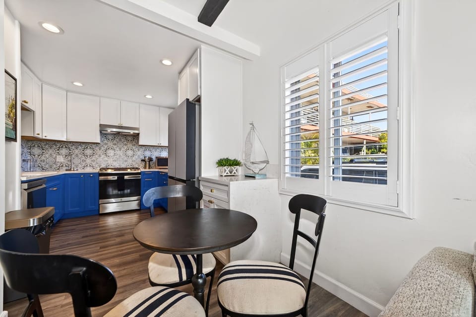 Enjoy casual meals at the dining table with seating for three, conveniently located within the bright and comfortable living area.