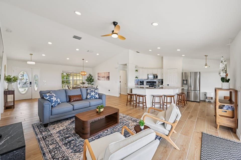 Spacious open living area connecting kitchen, dining, and lounge.