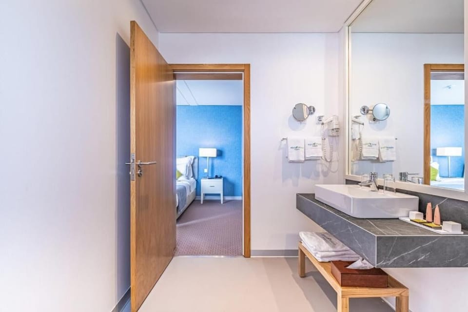 Refresh effortlessly in a spotless vanity area with plush towels.