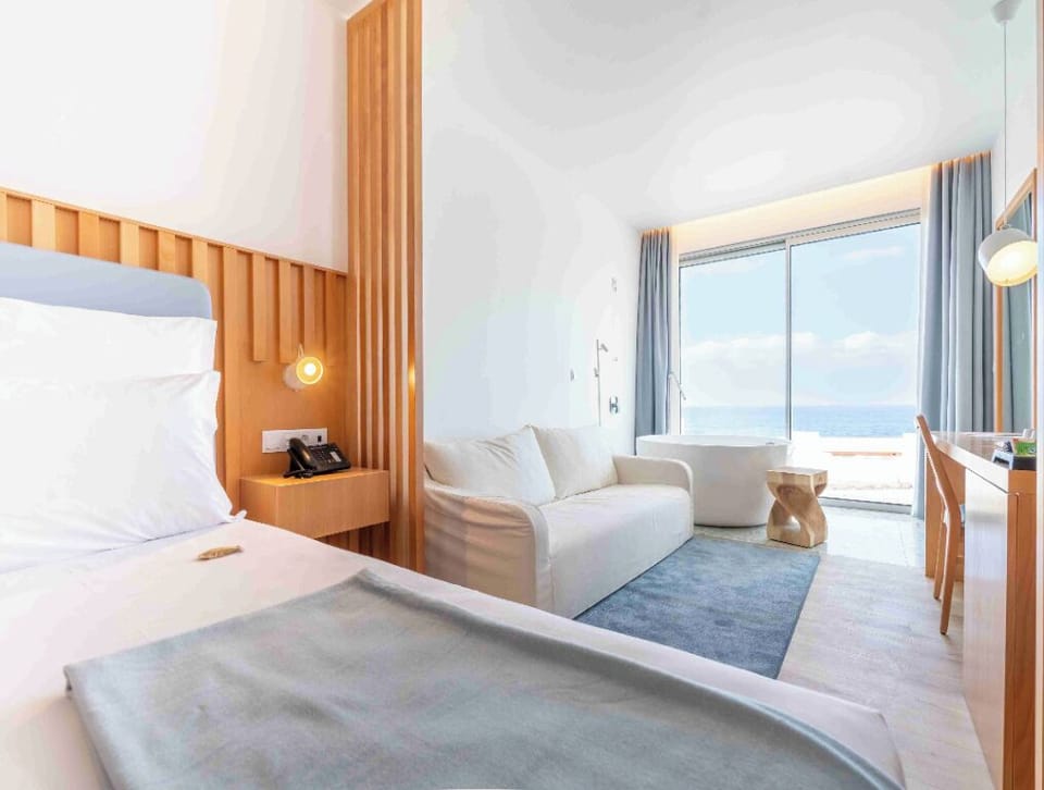 Lounge by the window and watch waves roll in.