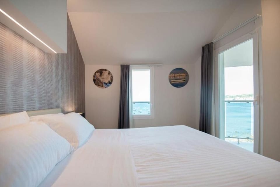 Wake to sweeping sea views right from your bed.